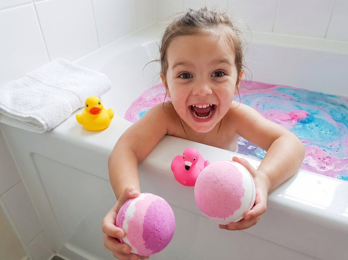 Happy child enjoying colorful bath time