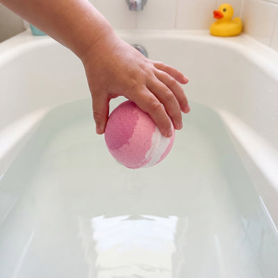 Drop bath bomb into water