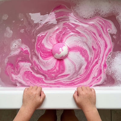 Bath bomb fizzing with colors